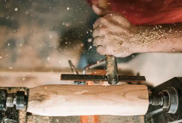 person holding gray metal tool