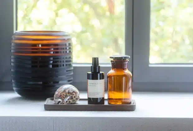 a window with a bowl of food and a bottle of liquid